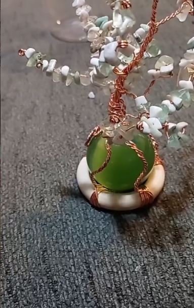 Handcrafted copper and gemstone tree by 3704 Jewelry Creations featuring wire-wrapped design and natural stones symbolizing grounding, balance, and intentional artistry.