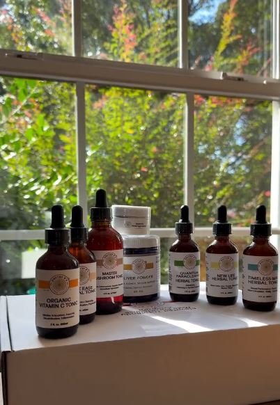 Doctah B Sirius’ Elevation Time organic elixirs displayed as potent herbal wellness tonics formulated to support immunity, detoxification, energy, and whole-body vitality using natural plant-based ingredients.