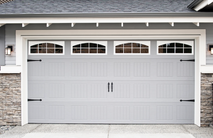 Custom garage door installation by Garage Doors Stockbridge featuring quality materials, precise craftsmanship, and tailored designs to enhance curb appeal and home functionality.