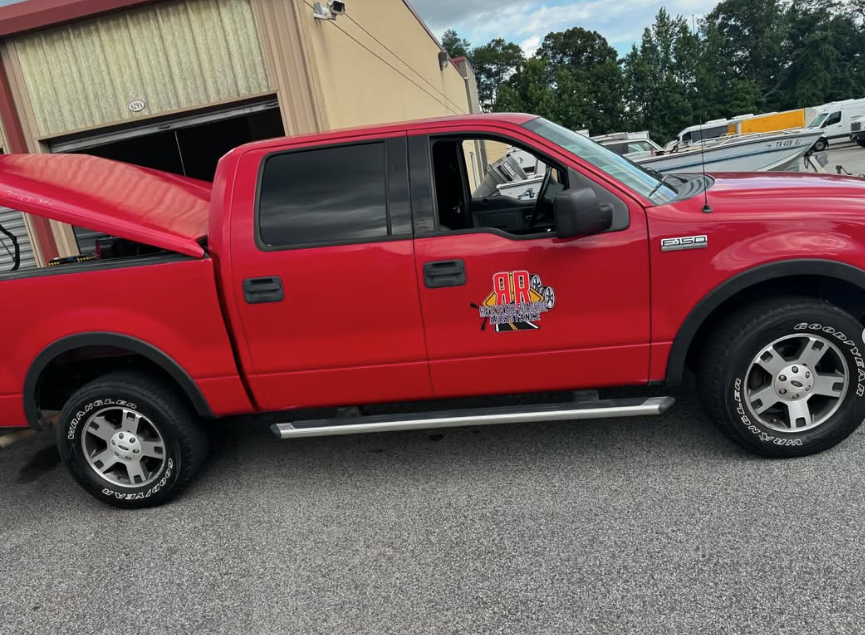 Red tow truck from Relentless Roadside Assistance highlighting emergency roadside support, towing services, and reliable vehicle assistance when drivers need help most.