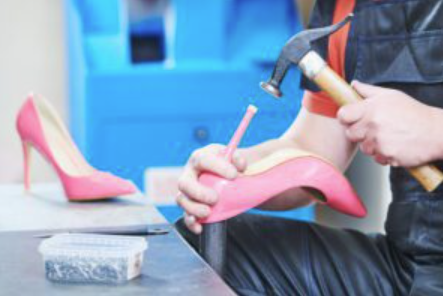 Professional repair of pink stilettos featuring heel restoration and structural repair performed by an experienced, family-owned shoe repair shop in Stockbridge, Georgia.
