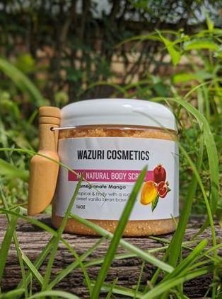 All-natural body scrub from Wazuri Cosmetics made with pomegranate and mango to gently exfoliate, refresh, and smooth skin while supporting hydration and healthy skin texture.