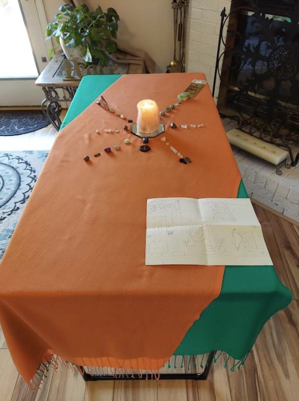 Energy grounding altar used to support balance, intention, and grounding during an energetic space clearing session.