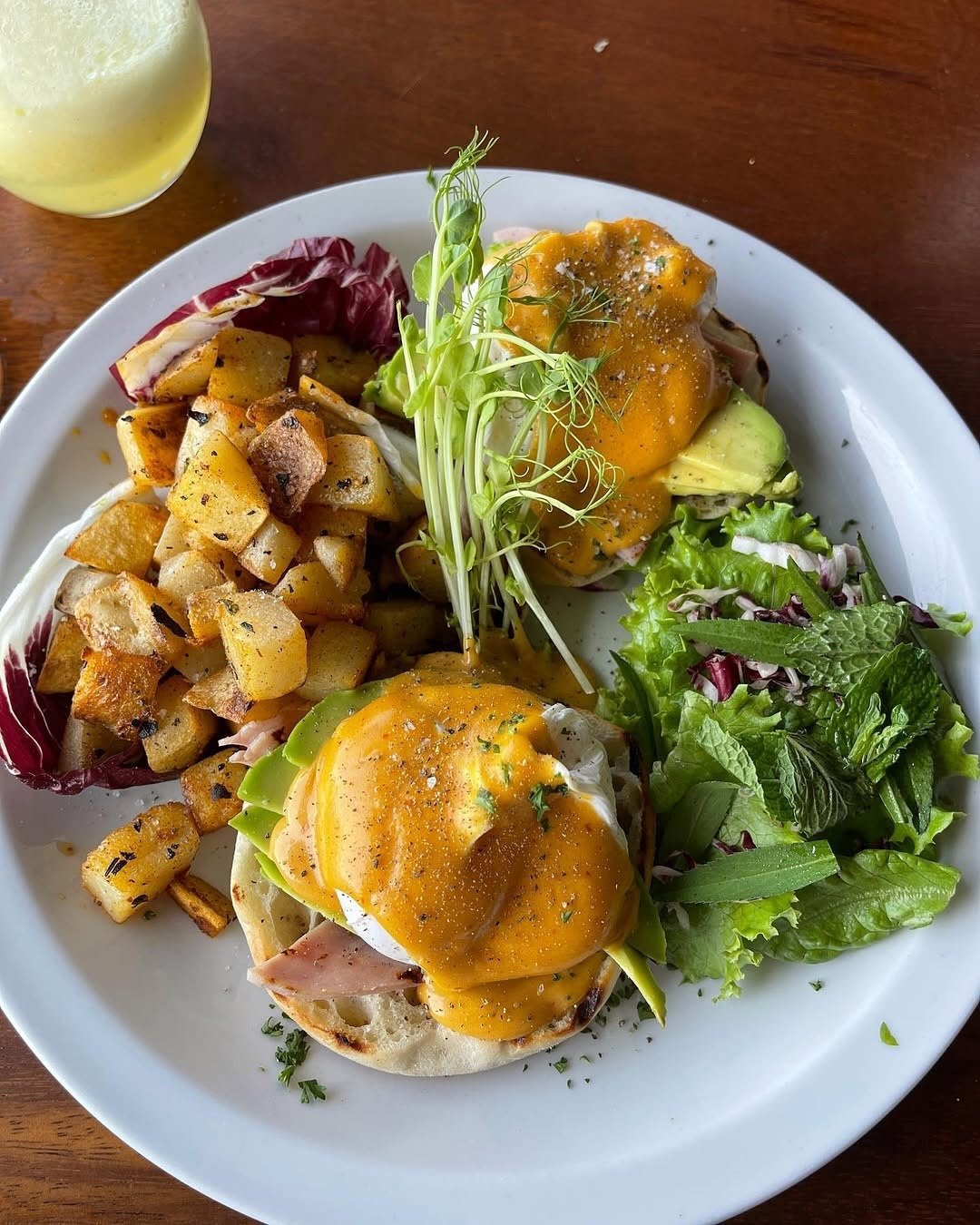 Eggs Benedict with Avocado Hollandaise and Home Fries – Emilios Cafe Manuel Antonio Costa Rica