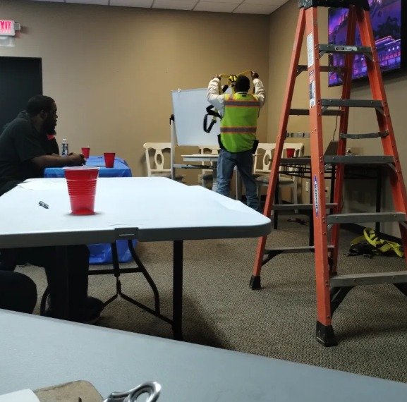 Electrician Installing Commercial TV and Wiring Indoors – Mr. Dees Electric Service LLC Stockbridge GA